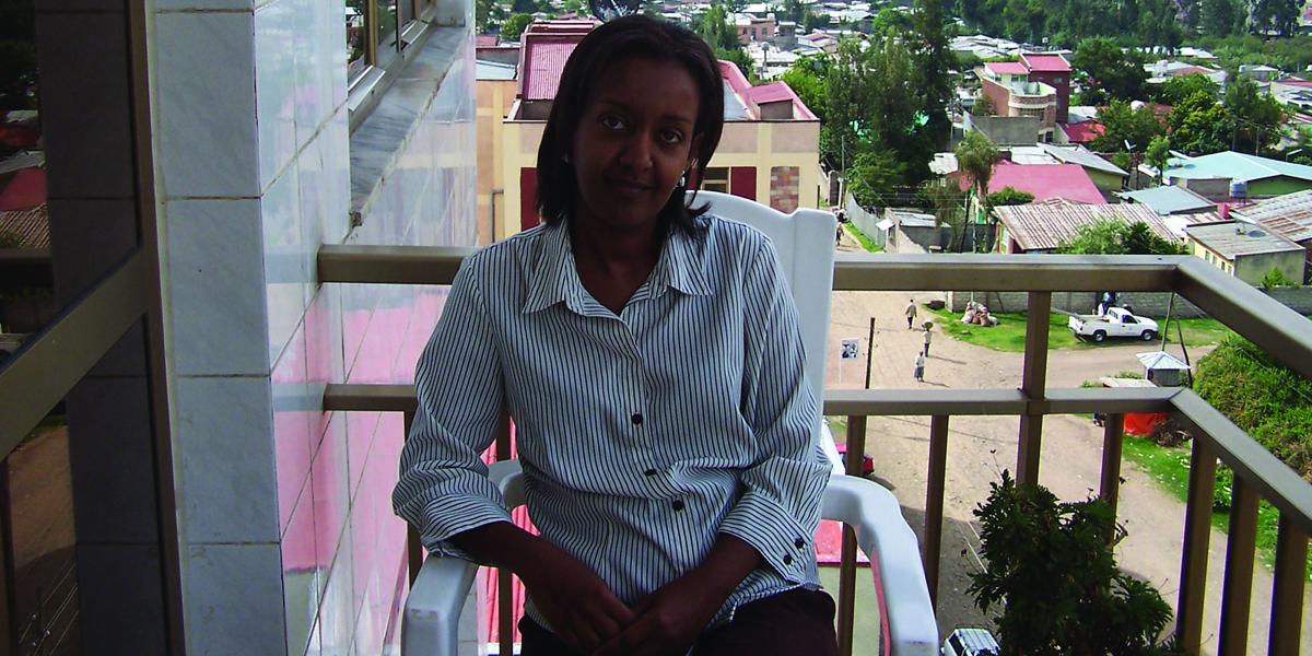 Aida Abashawl sits on a balcony in Addis Ababa