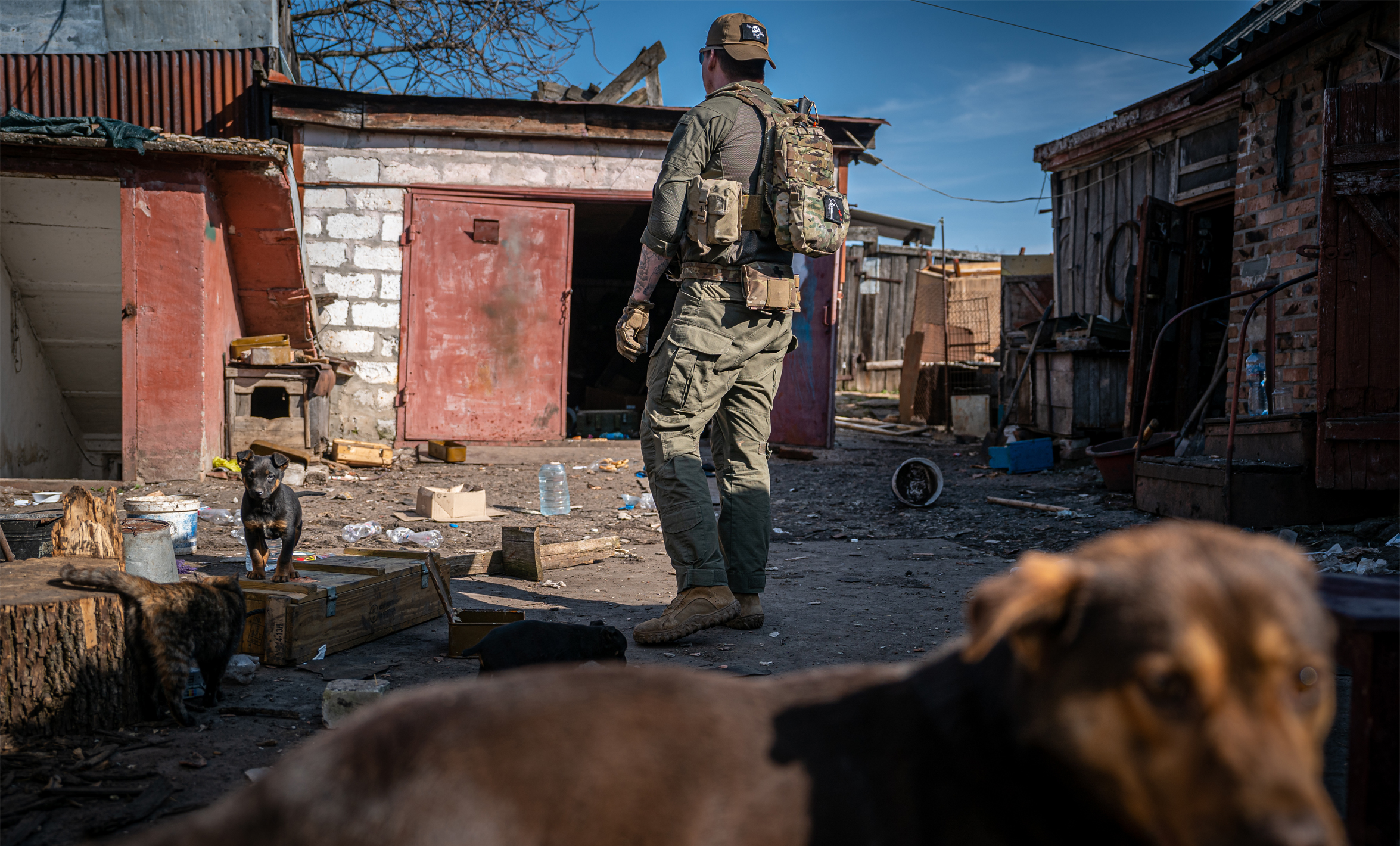 A volunteer inspects an abandoned house in a village near the Donetsk frontline as Russian-Ukrainian war continues, in Yurkivka, Ukraine on March 23, 2023. Photo by Ignacio Marin/Anadolu Agency via Getty Images.