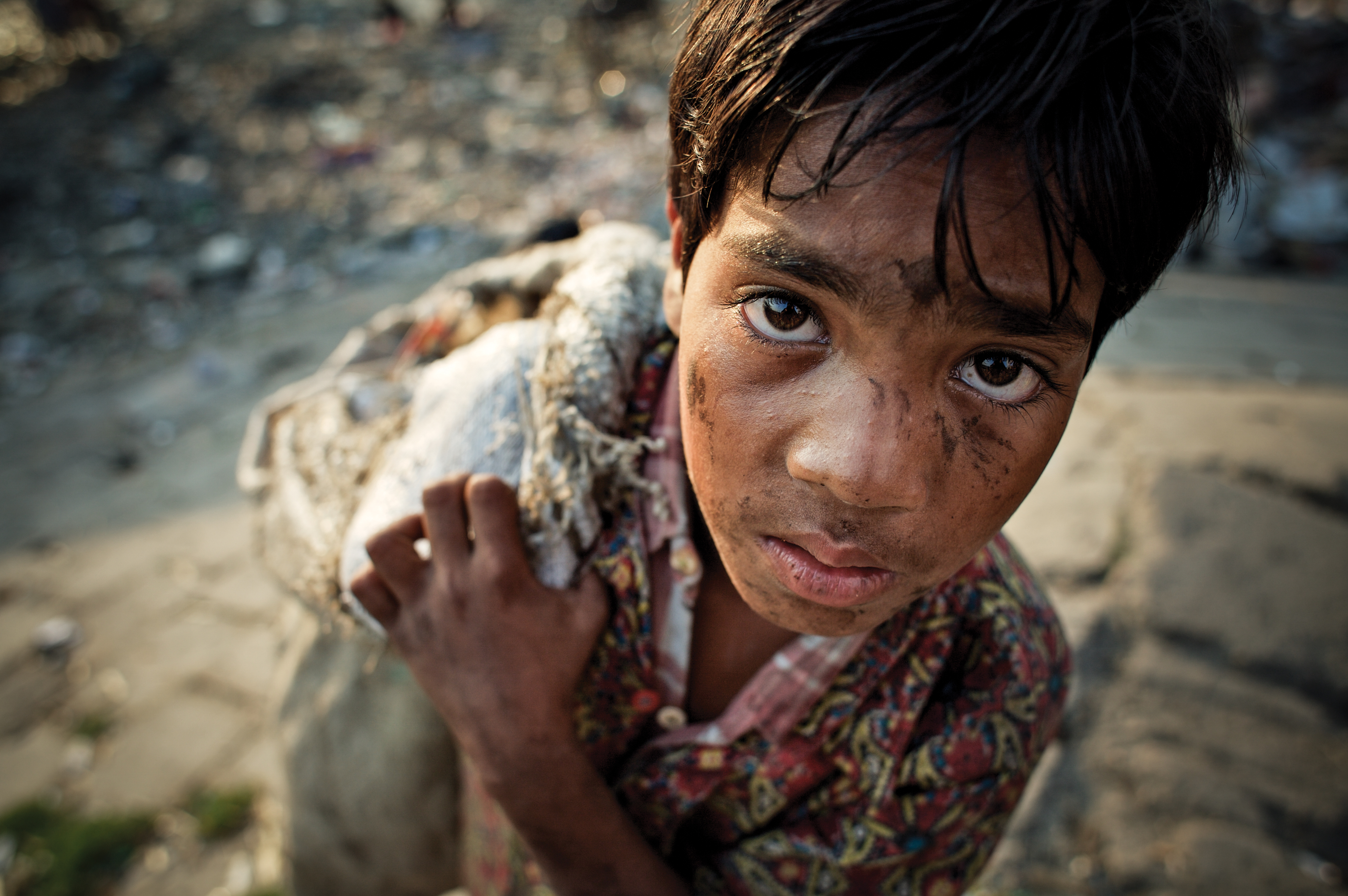 12 year-old-boy scavenging in Bangladesh.