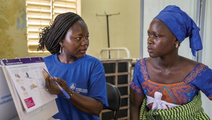 In a Laniar, Senegal, health center, a health worker from Marie Stopes offers reproductive health counseling and family planning in 2014.