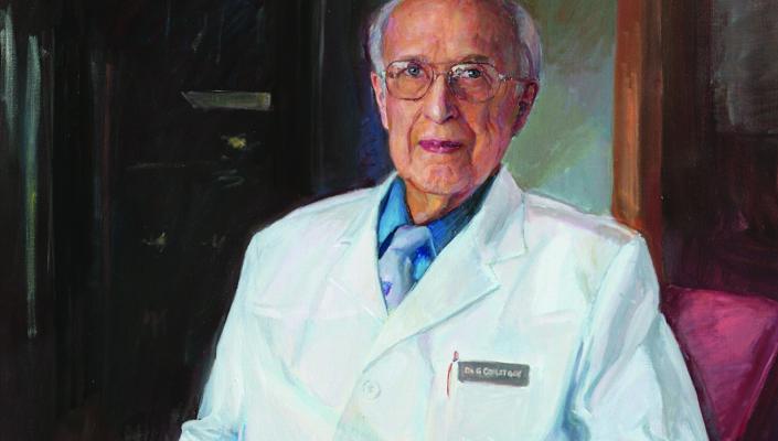 Painting of George Comstock, seated, wearing a lab coat