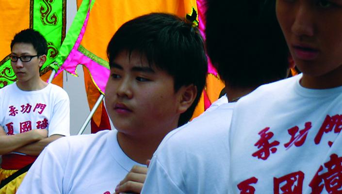 photo of 3 Chinese youths, one of whom appears to be overweight