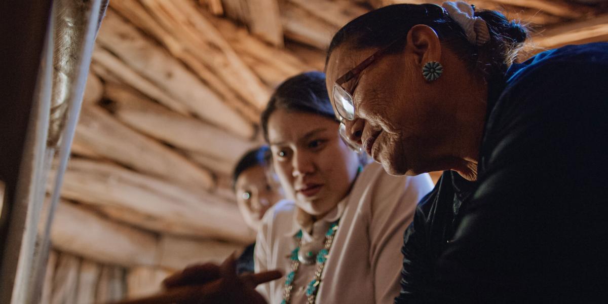 A Navajo grandmother and two teenage granddaughters