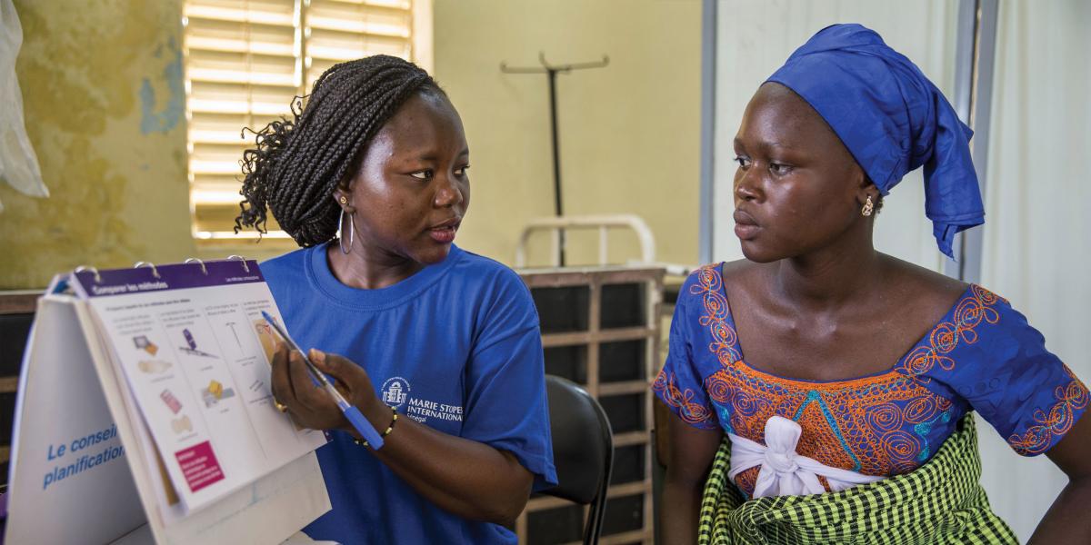 In a Laniar, Senegal, health center, a health worker from Marie Stopes offers reproductive health counseling and family planning in 2014.