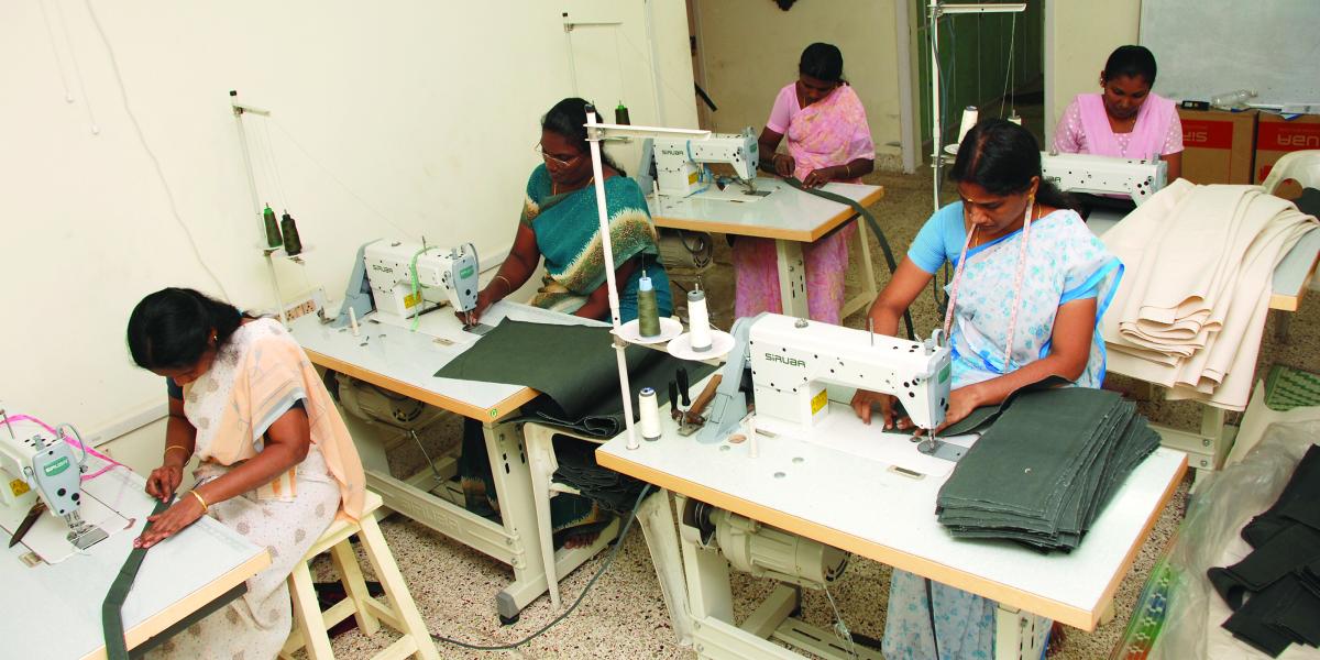 3 Indian women working at sewing machines