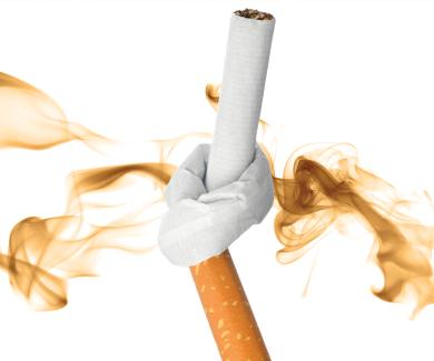  A cigarette tied in a knot over a cloud of smoke.