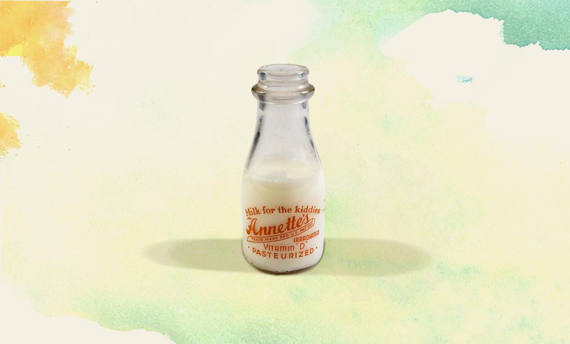 a glass milk bottle with this text: Milk for the Kiddies, Annette's irradiated Vitamin D Pasteurized